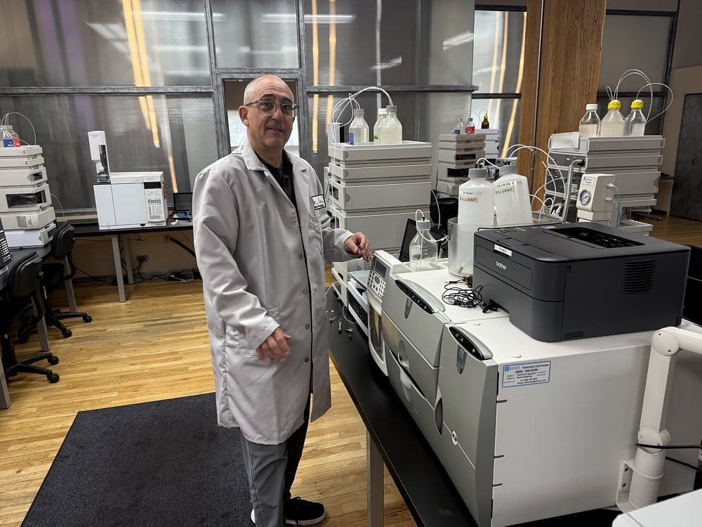 Orange County DUI attorney Richard Wagner in lab coat at Axion Analytical Laboratories completing hands-on forensic chromatography training